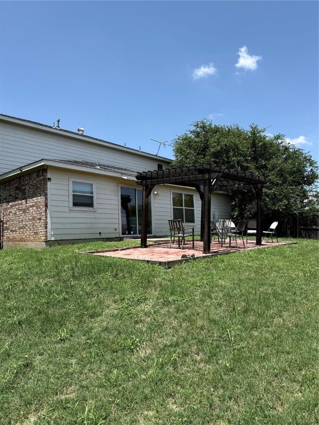 Back of house featuring a pergola, a patio area, and brick siding | Image 30
