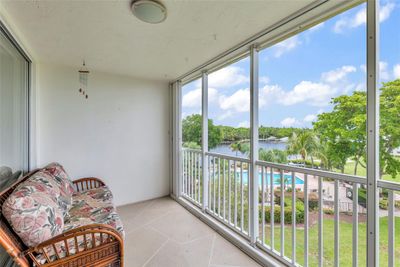 Enjoy relaxing on the screened porch overlooking the pool with main intracoastal views | Image 3