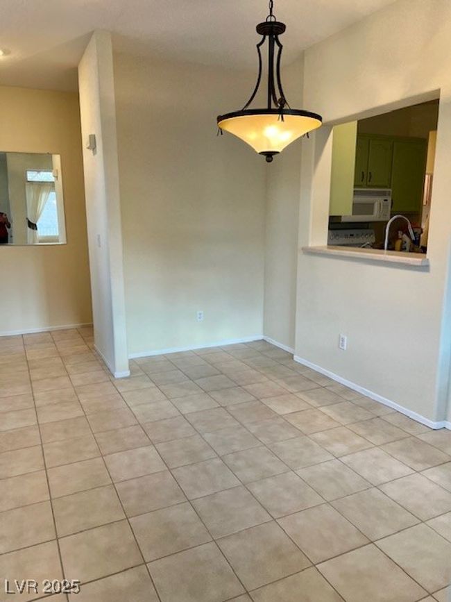Spare room featuring baseboards, a sink, and light tile patterned floors | Image 10