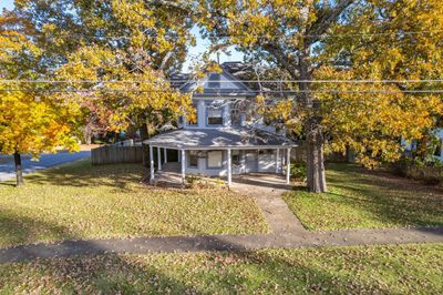 View of front of home with a front yard and covered porch | Image 3