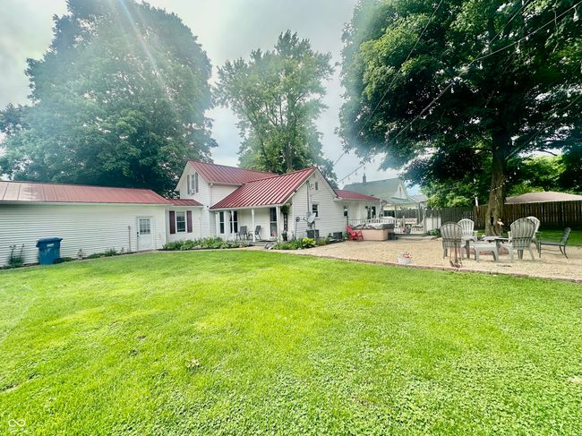 back of property with a patio area and a metal roof | Image 10