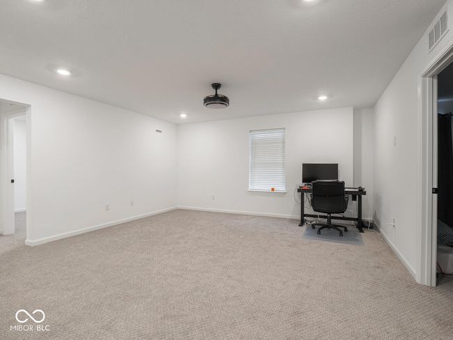 carpeted office space with visible vents, baseboards, and recessed lighting | Image 29