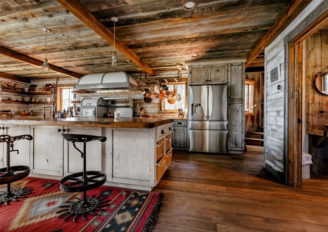Gourmet Kitchen with copper & chestnut counter tops. | Image 17