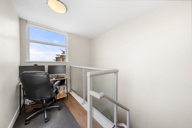 Office with wood finished floors and baseboards | Image 25