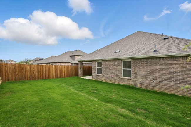 View of fenced backyard | Image 30