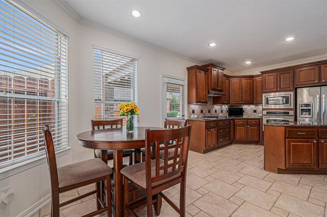 A cheery breakfast room is the perfect spot to sit and enjoy a morning cup of coffee before the house wakes up and starts their day! | Image 11