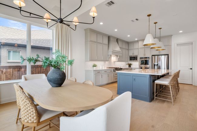 Dining space with light wood-style flooring, recessed lighting, and a chandelier | Image 18