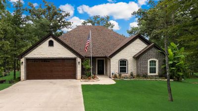 View of front of home with a garage and a front lawn | Image 2