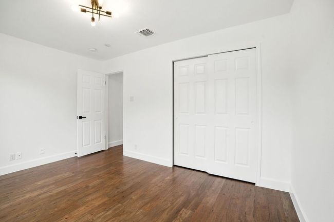 The secondary bedrooms are located at the front of the home, ideal for a guest suite or home office setup. | Image 21
