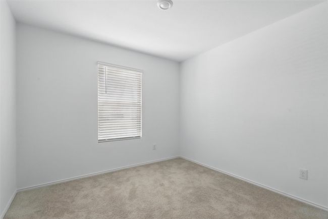 Carpeted empty room featuring baseboards | Image 15