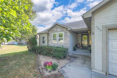 Doorway to property with a yard | Image 2