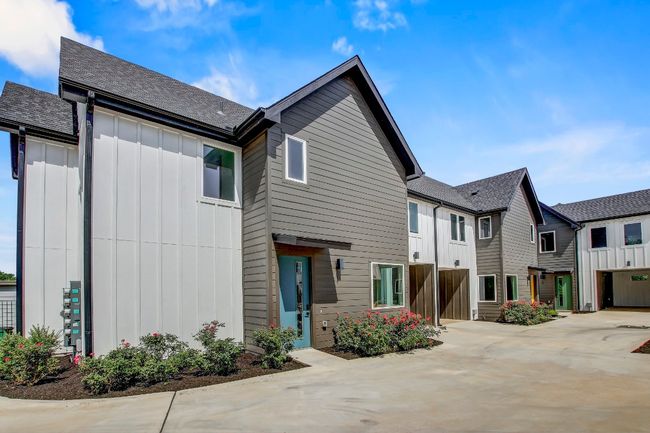 Multi unit property with board and batten siding and roof with shingles | Image 28