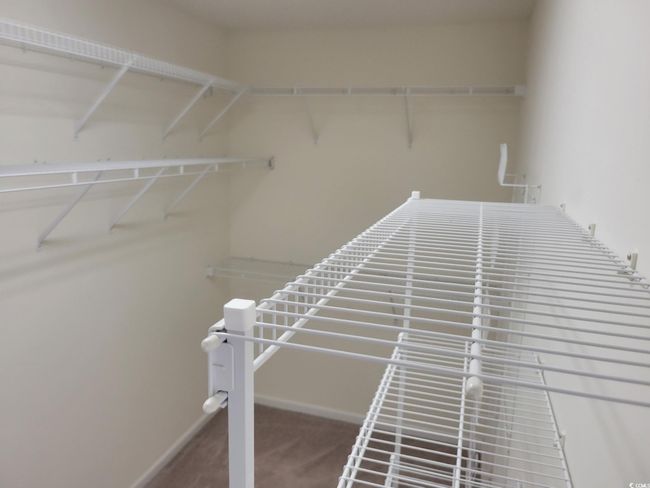 View of walk in closet | Image 10