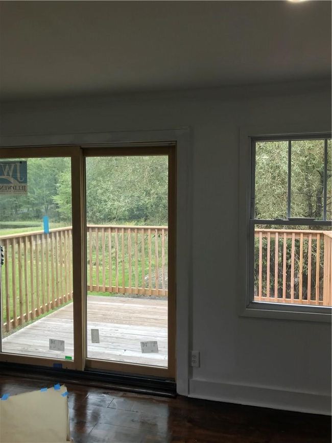 Entryway featuring plenty of natural light and dark hardwood / wood-style floors | Image 18