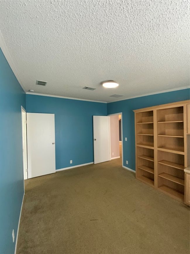 Unfurnished bedroom with baseboards, visible vents, a textured ceiling, and carpet flooring | Image 24