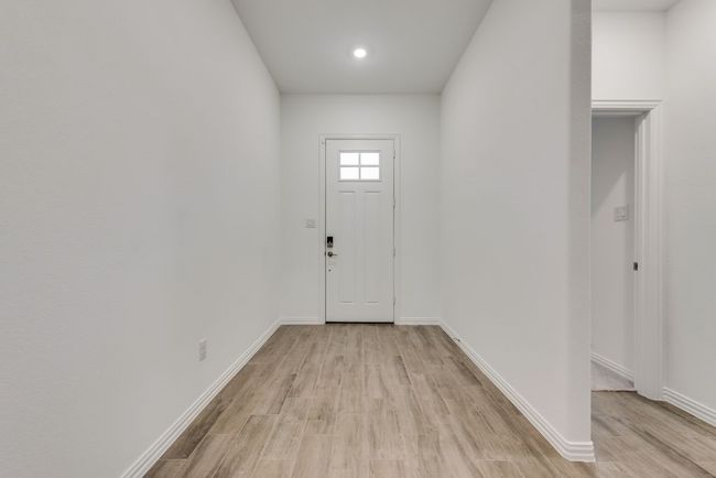 Foyer entrance with light wood-type flooring and recessed lighting | Image 7