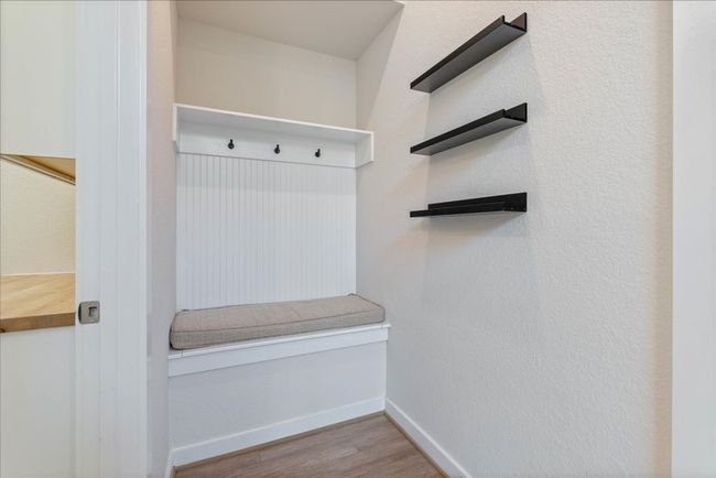 Mudroom with wood finished floors and baseboards | Image 37