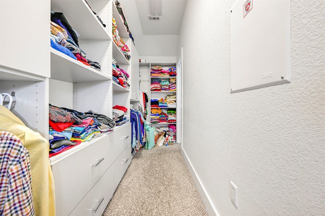 Walk in closet featuring carpet flooring | Image 18