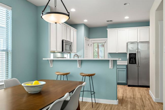 The dining area’s easy access to the kitchen make it a versatile space, whether you're hosting a dinner party or enjoying a quiet meal | Image 12
