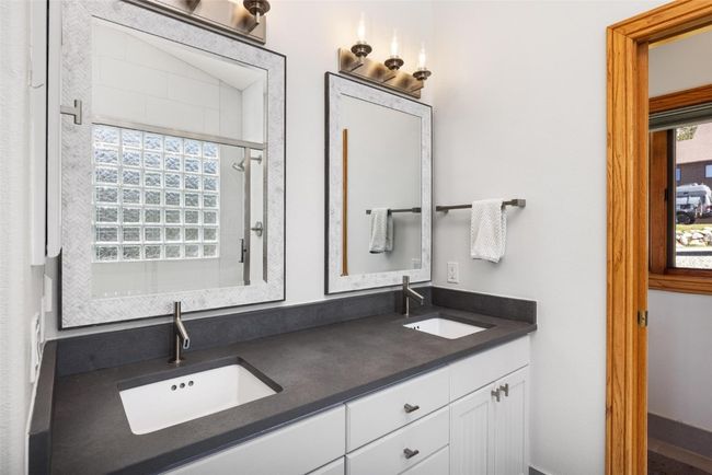 Full bathroom with double vanity and an enclosed shower | Image 10
