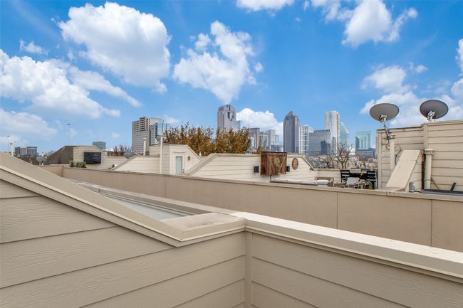 Balcony featuring a view of city | Image 17