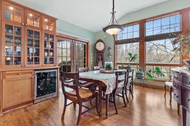 Eating area open from kitchen. French doors to full length covered patio. Floor-to-ceiling windows overlook back yard, and your private horse paddock. | Image 9
