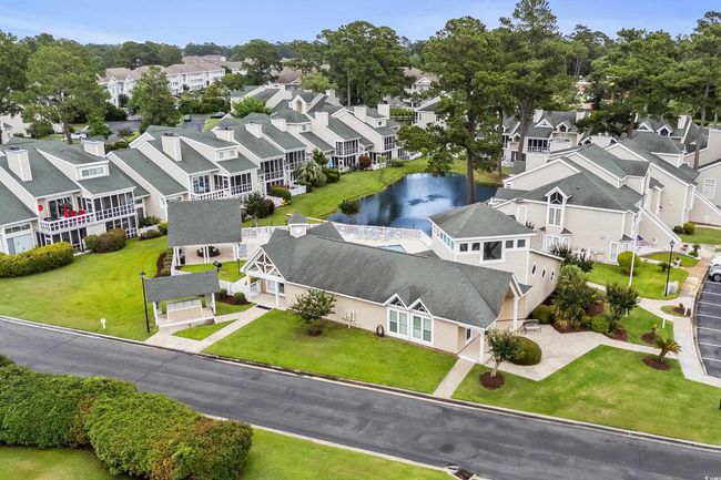 Aerial perspective of suburban area with a nearby body of water | Image 20