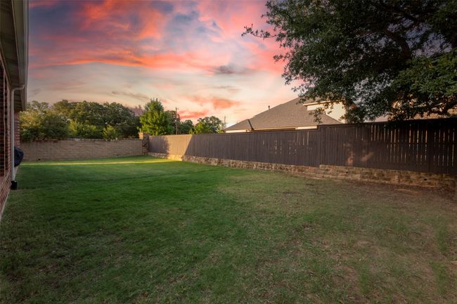 View of fenced backyard | Image 36