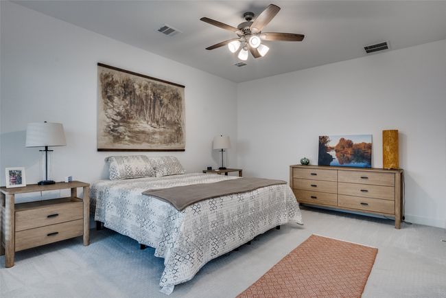 Downstairs Master Bedroom with light colored carpet and a ceiling fan | Image 20