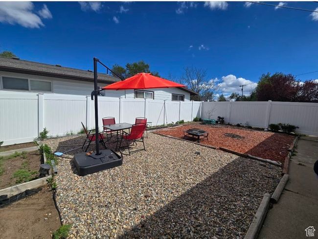 View of yard with a fenced backyard and a patio | Image 17