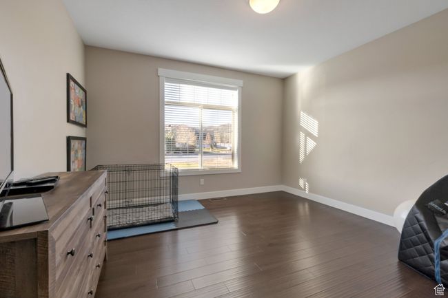 Office area with baseboards, dark wood-style floors, and visible vents | Image 31