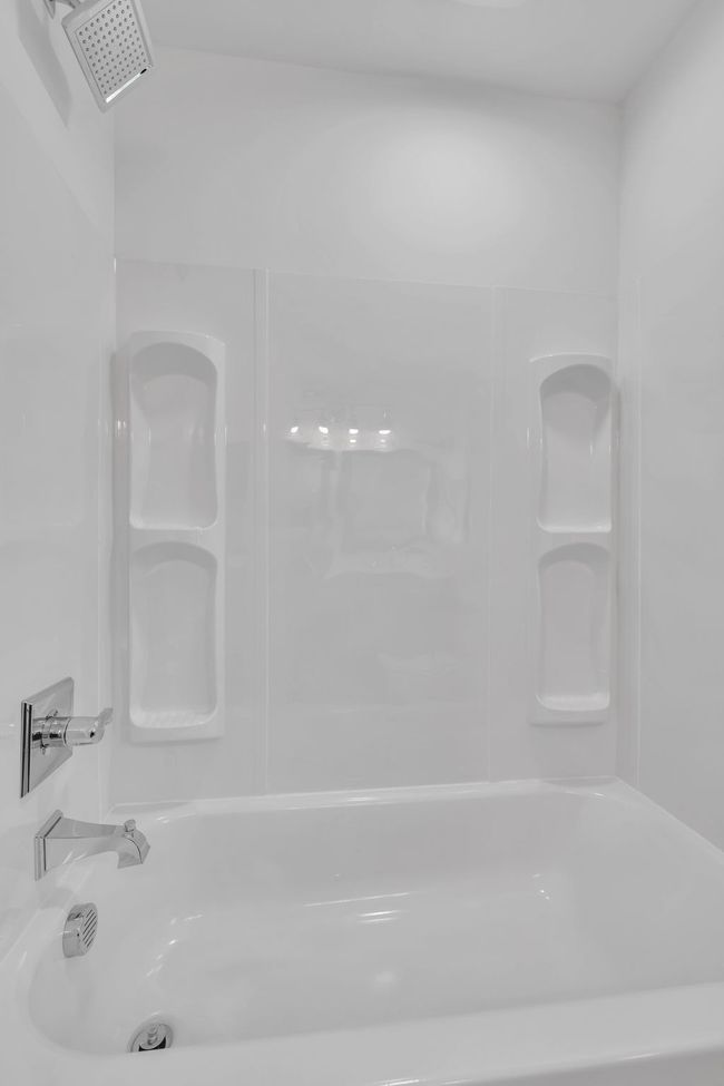 Upstairs bathroom shower/tub unit. | Image 35