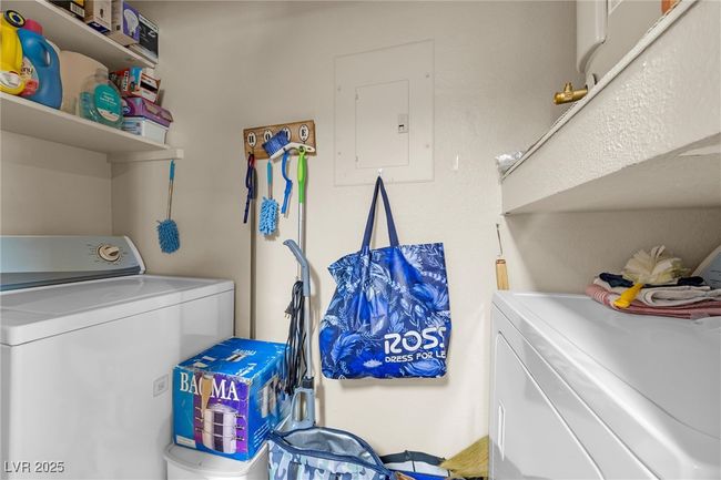 Laundry room with washer and clothes dryer, laundry area, and electric panel | Image 22