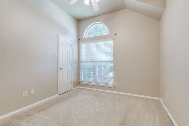 Unfurnished room with carpet floors, a ceiling fan, and lofted ceiling | Image 16