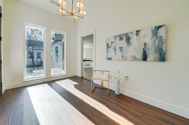 Sitting room with dark hardwood / wood-style flooring and a notable chandelier | Image 15