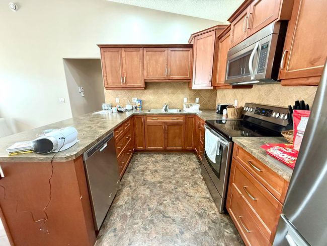 304 Sunvale Cres Ne, Townhouse with 2 bedrooms, 1 bathrooms and 2 parking in High River AB | Image 16
