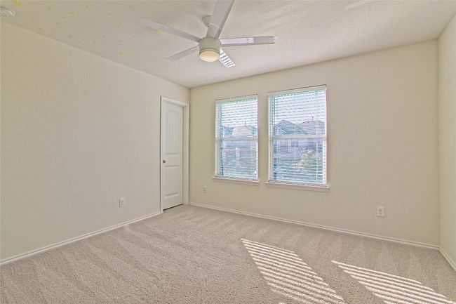 Spare room with light carpet and a ceiling fan | Image 27