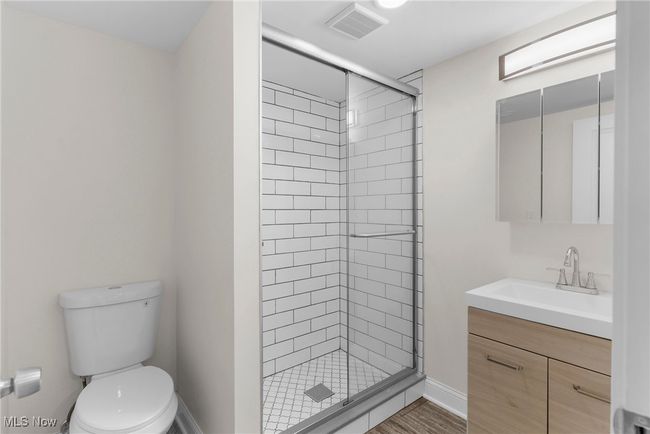 Full bathroom featuring vanity and a shower stall | Image 35