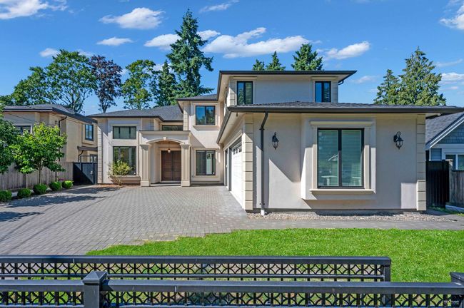 Contemporary home featuring stucco siding and driveway | Image 34