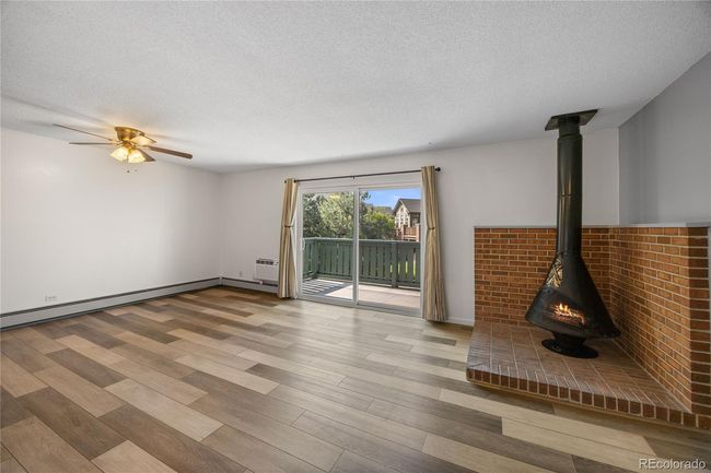 Living room with large rear slider that opens to a quite private patio | Image 10