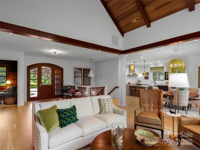 Open floor plan on main level with great flow from the entry to living room, dining area and into kitchen. | Image 9