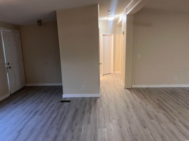 Hall featuring light wood finished floors and baseboards | Image 17