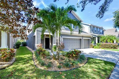 Beautiful curb appeal with well-manicured landscaping and 3 car garage! | Image 2