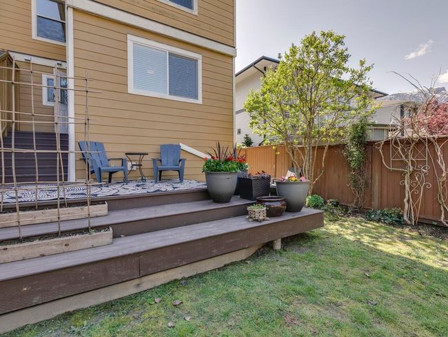 Exterior space featuring a lawn, fence, and a deck | Image 36