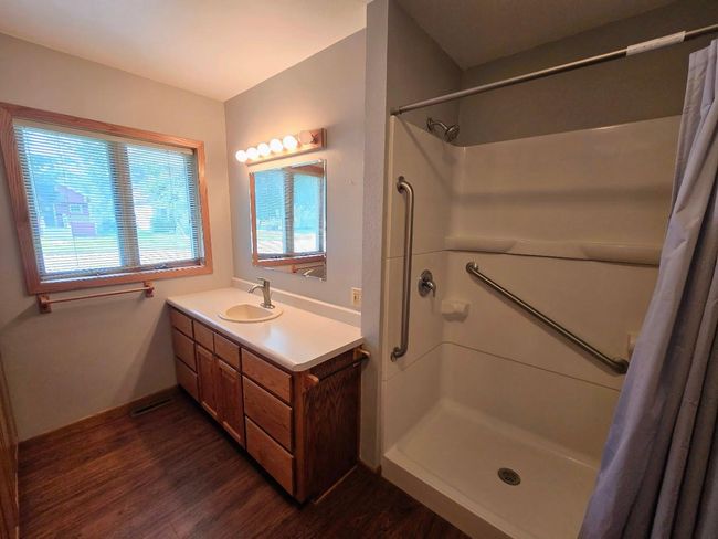 Vanity and interior view of shower | Image 25