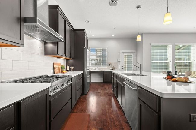 Soft under-cabinet lighting adds warmth to the space, creating an inviting atmosphere where you’ll want to spend hours cooking and entertaining | Image 16