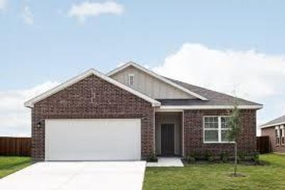 View of front facade featuring a front yard and a garage | Image 1