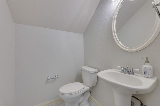 Half bath with lofted ceiling and toilet | Image 27