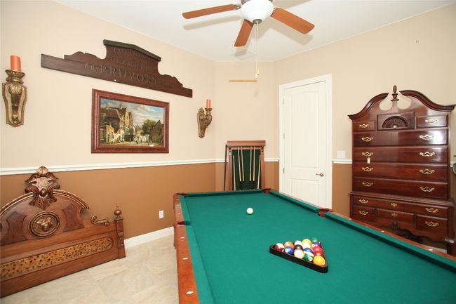 Recreation room with billiards and ceiling fan | Image 17