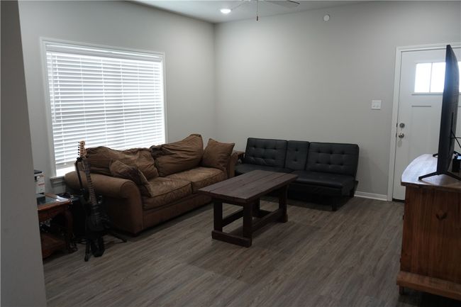 Living room featuring wood finished floors, a ceiling fan, and recessed lighting | Image 12